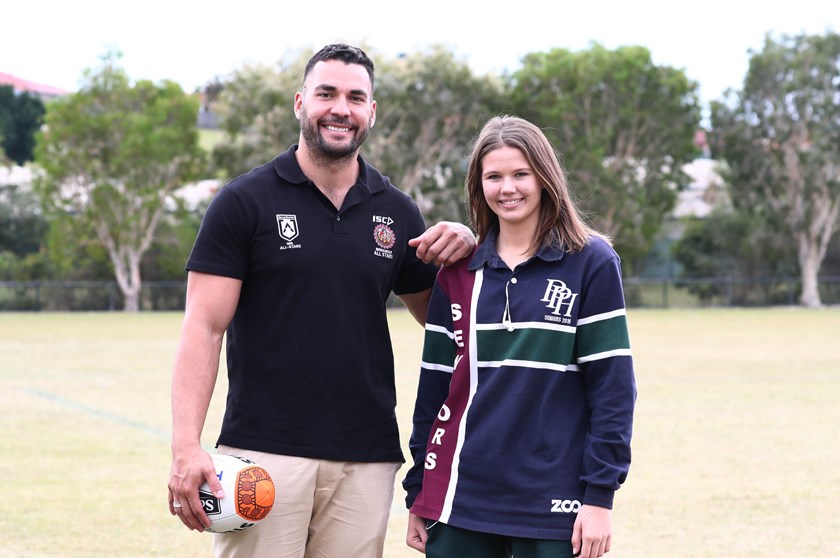 NRL Young Person of the Year, Holly Summers, with Titans captain Ryan James.