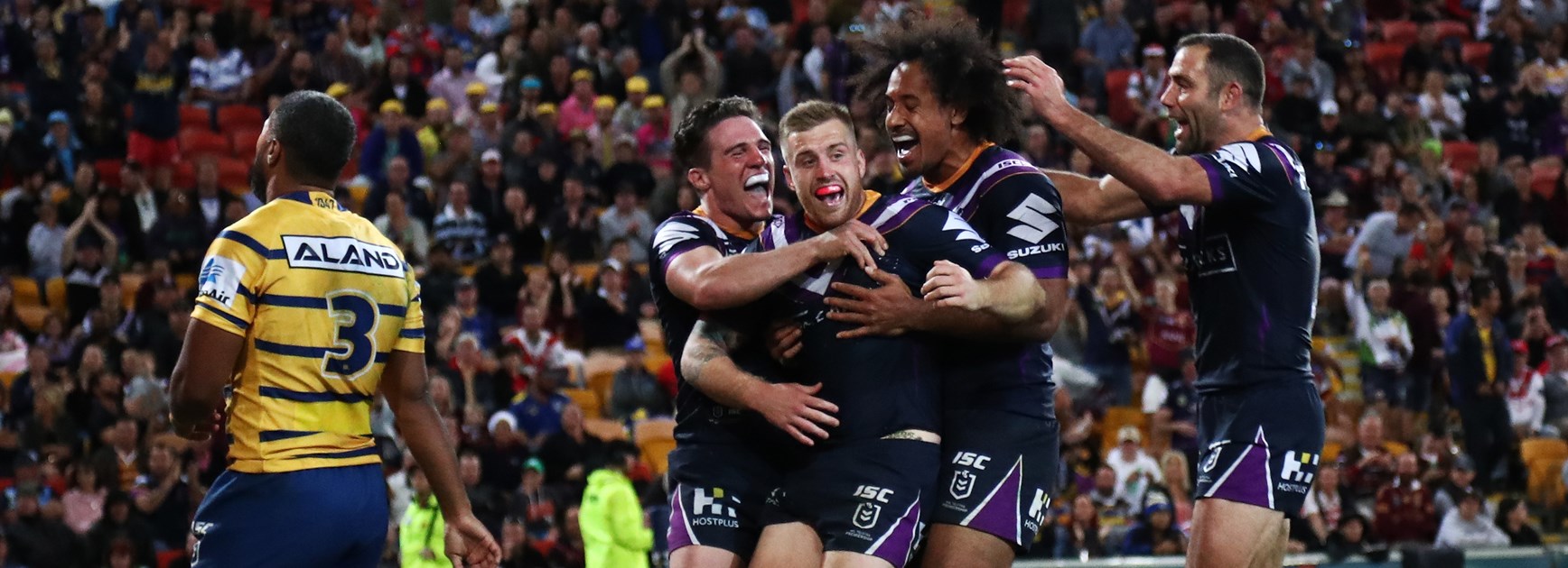 The Storm celebrate a Cameron Munster try.