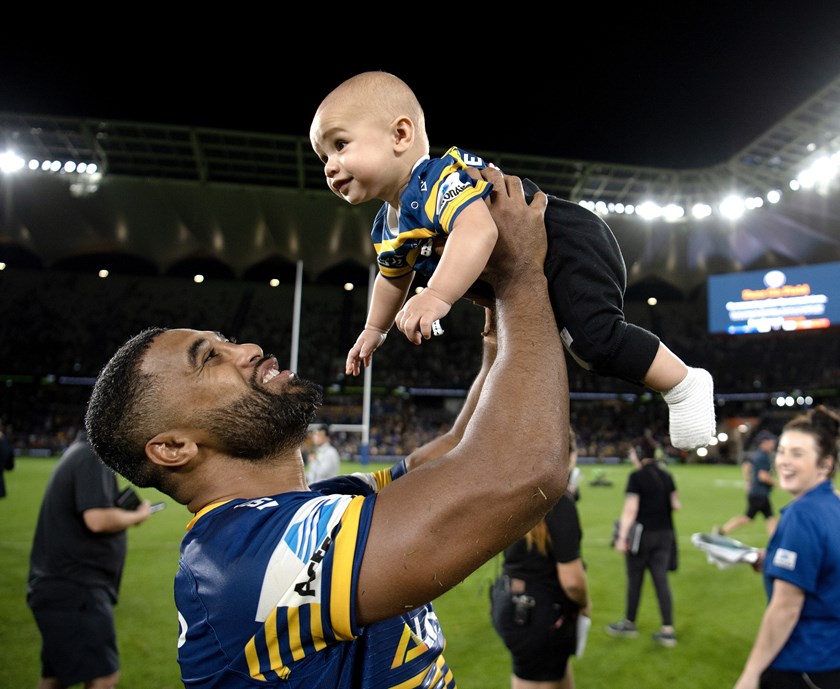 Michael Jennings with son Carter after an Eels win.