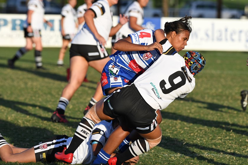 Tanika Marshall is brought down in a tackle while playing for Brothers Ipswich.