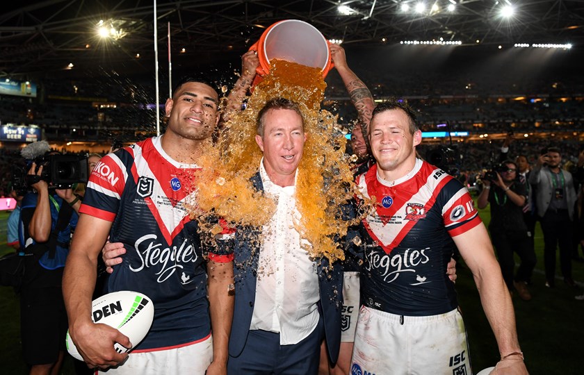 Roosters coach Trent Robinson gets drenched after the 2019 grand final win.
