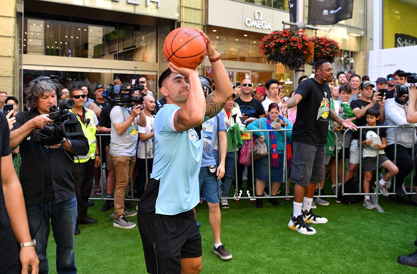 Shaun Johnson shows off his form in front of NBA great Paul Pearce.
