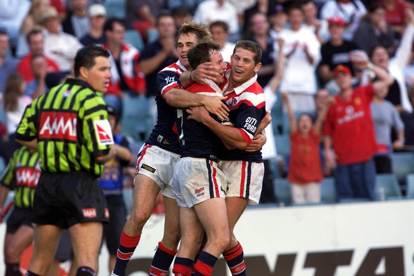 Justin Holbrook celebrates a Roosters try with Bryan Fletcher.
