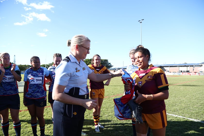 NSW Country star Simone Smith is presented with an ADF jersey at the Womens National Championships.