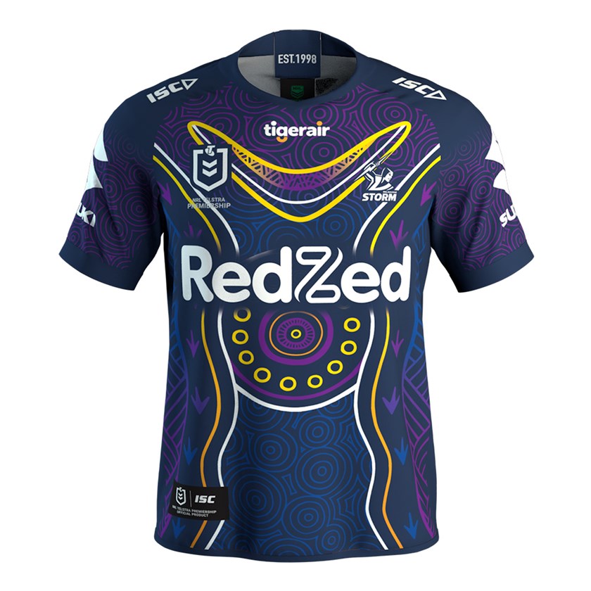 Melbourne's Indigenous Round jersey, designed by Ky-ya Nicholson Ward, a 17-year-old Wurundjeri, Dja Dja Wurrung, and Ngurai illum Wurrung woman.
The jersey is called ‘Jindi Worobak’ which means ‘Join and Unite’ in Woiwurrung which is the language of my people, the Wurundjeri people, the traditional custodians of Narrm (Melbourne). This is my way as an artist to acknowledge the players, the workers, volunteers and fans that all join and unite to create the amazing Melbourne Storm community and environment. The centre circle on the jersey represents AAMI Park, and the white circles represent the staff, fans and crowd who come united as one to support the players. It represents how when we all come together as one, we are stronger. The joint circles flowing through the middle section of the jersey represent the Birrarung (Yarra River) which is a very significant and spiritual river to my people. ‘Birrarung’ means ‘river of mists’ in Woiwurrung, this is because the mist dances along the river at dawn which is linked to my people’s dreamtime/creation stories. 