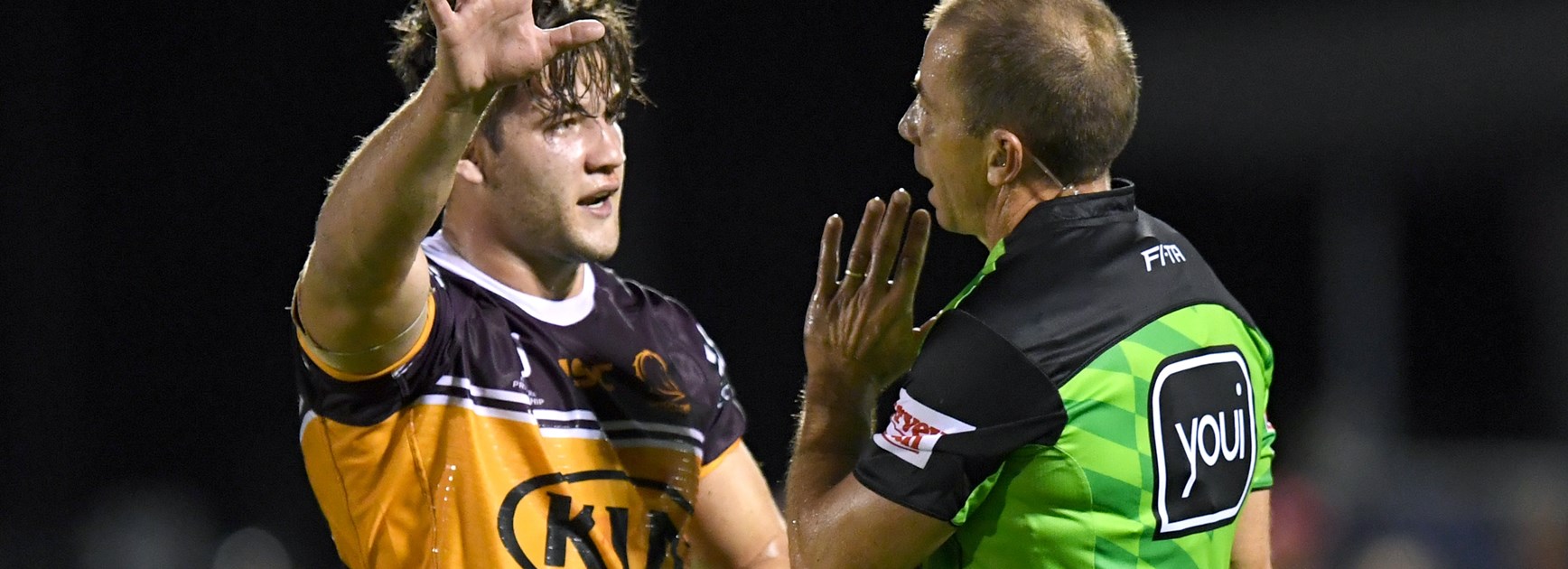 Broncos skipper Patrick Carrigan with referee Ben Cummins.