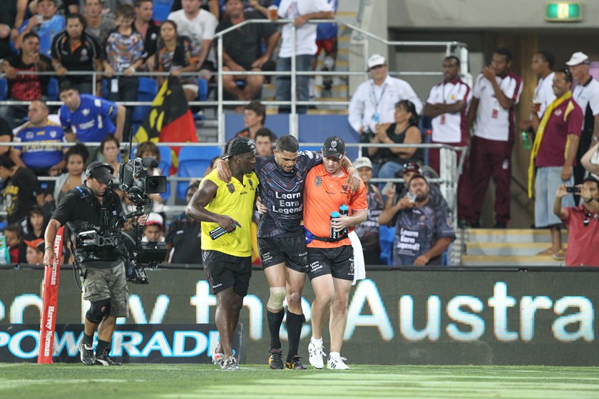 Greg Inglis is helped from the field during the 2012 All Stars game.