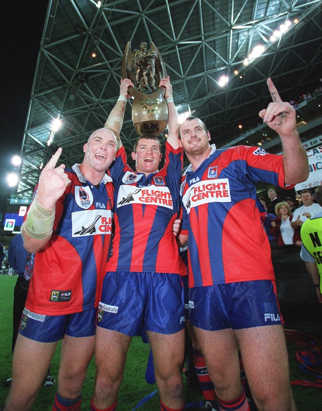 Celebrating the 2001 premiership with Ben Kennedy and Steve Simpson.