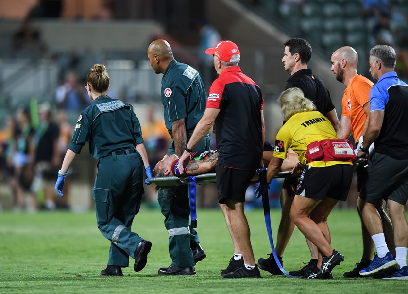 Holli Wheeler is carried off after suffering a suspected ACL injury.