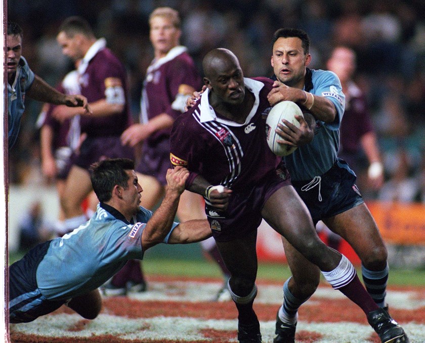 Wendell Sailor grapples with Blues duo Andrew Johns and Laurie Daley.