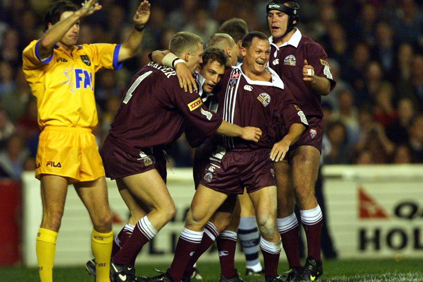 Kevin Walters is swamped during Origin I in 1998 after scoring a try in the seventh minute.