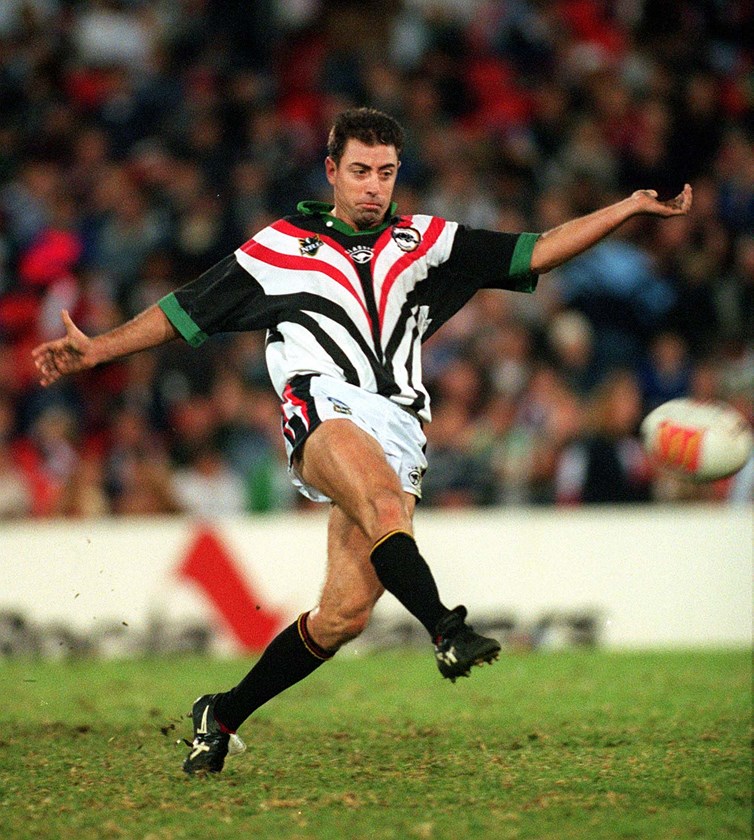 Greg Alexander boots the ball for Penrith in 1999.