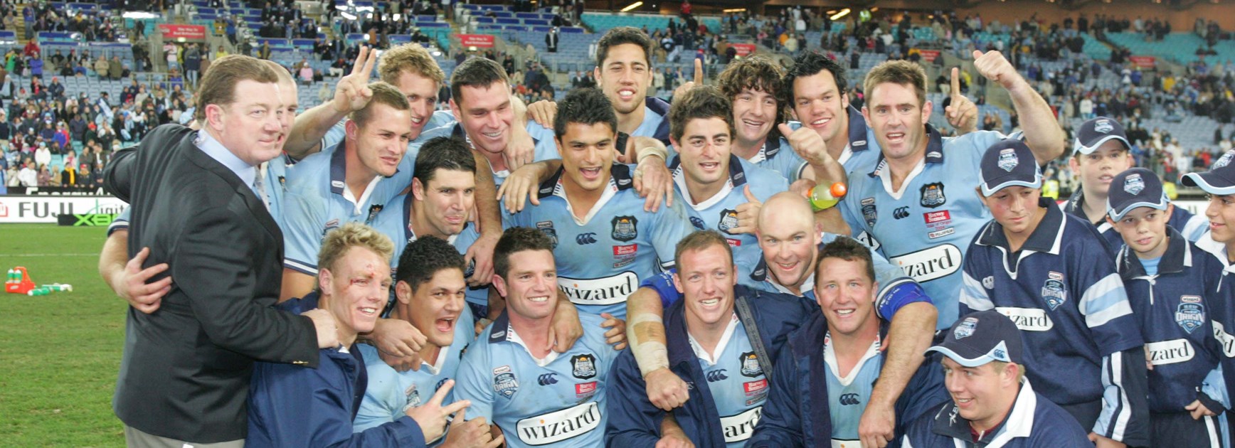 NSW celebrate after getting their hands on the 2004 State of Origin shield.