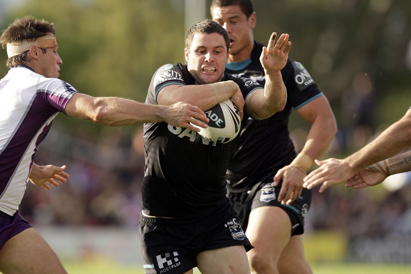 Michael Gordon runs into the teeth of the Storm defence in 2011.