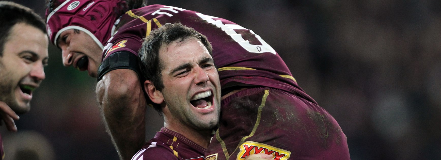 Cameron Smith and Johnathan Thurston celebrate.