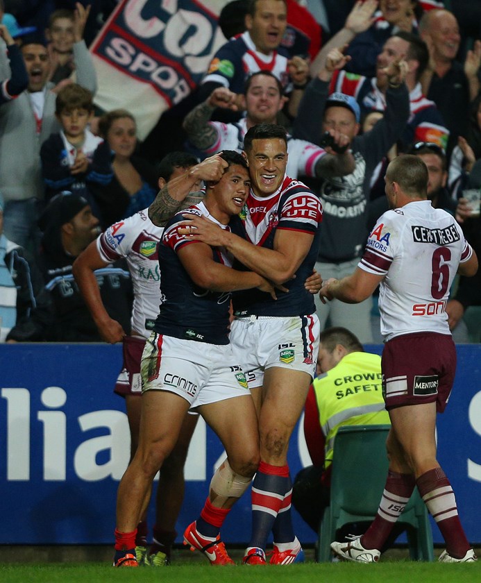 Roger Tuivasa-Sheck is congratulated by Sonny Bill Williams after scoring what turned out to be the only points of the qualifying final against Manly.