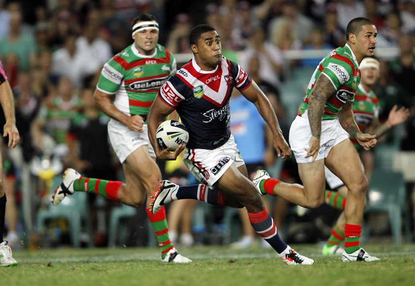 Michael Jennings jets off for the Roosters in 2013.