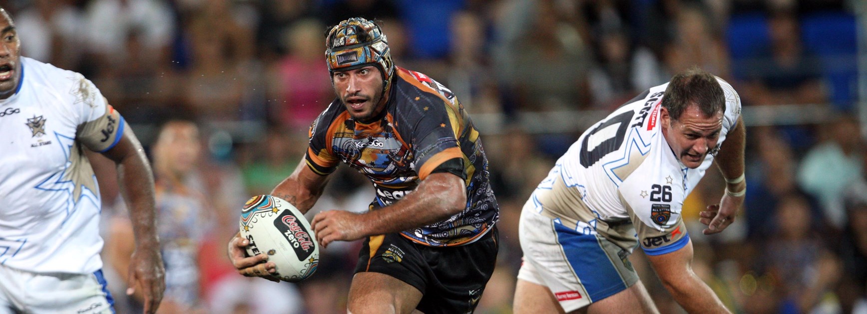 Thurston evades Cowboys teammate Matt Scott while representing the Indigenous All Stars in 2011.