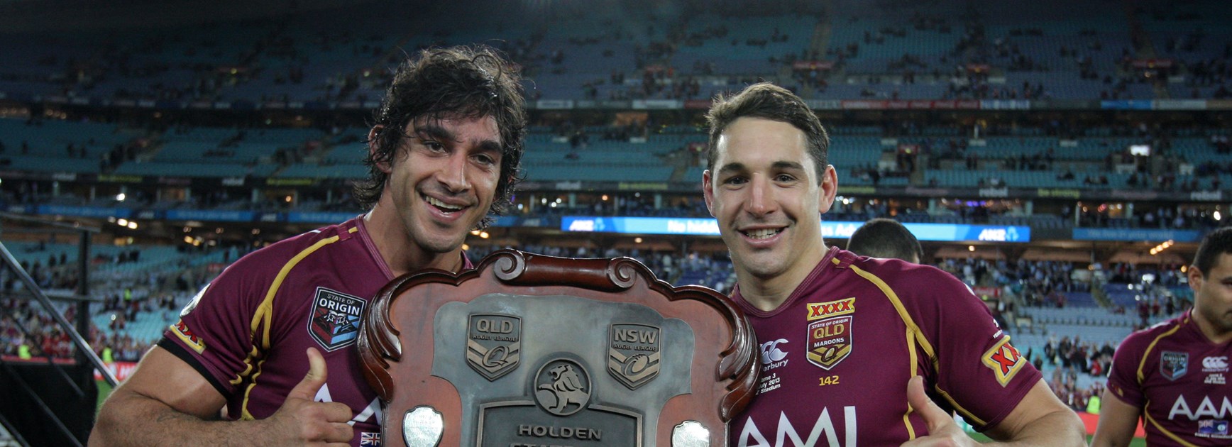 Thurston celebrates the 2013 State of Origin win with long-time rep teammate Billy Slater.
