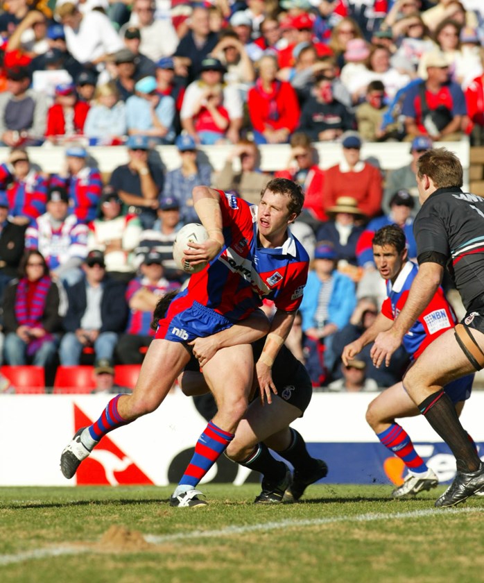 Clint Newton slips a pass away for the Knights early in his career in 2002.