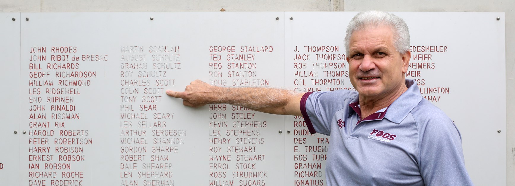 Colin Scott points to his name on the honour board of Queensland representatives asides from the Origin arena out the front of Suncorp Stadium.