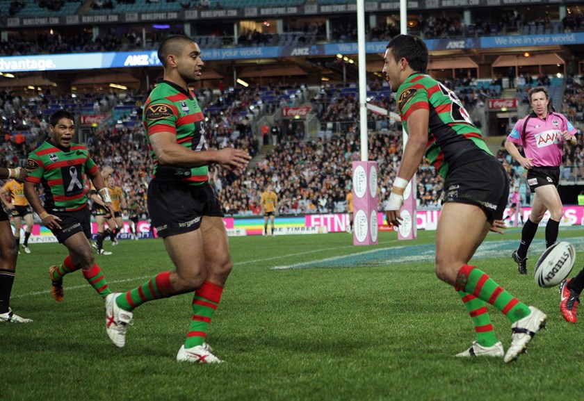 Dylan Farrell is congratulated by Nathan Merritt after scoring one of his three tries.