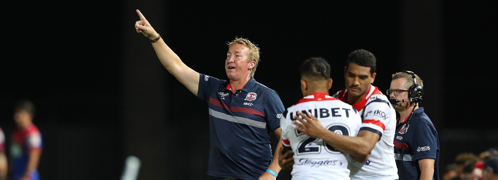 Trent Robinson makes some sideline instructions against Newcastle.