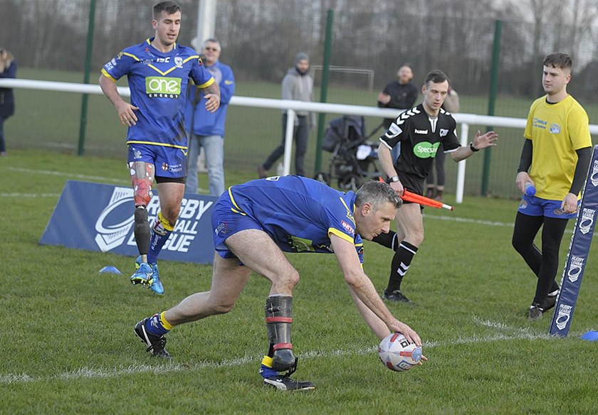Adam Hills scores a try for Warrington  Wolves.