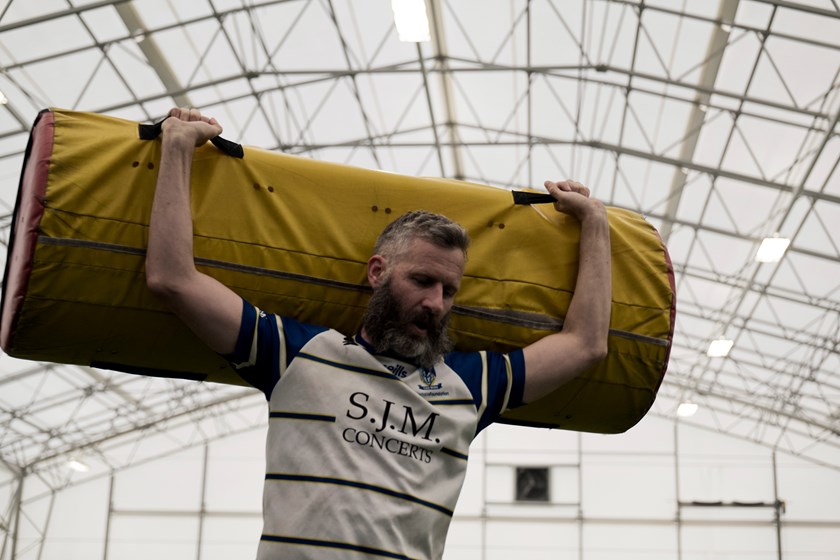 It doesn't matter how famous you are, Adam Hills helps pack up after training.