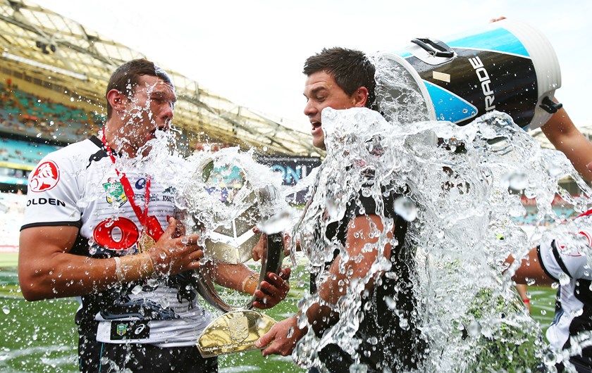 Brent Naden and coach Cameron Ciraldo get an early shower after the under-20 grand final win in 2015.
