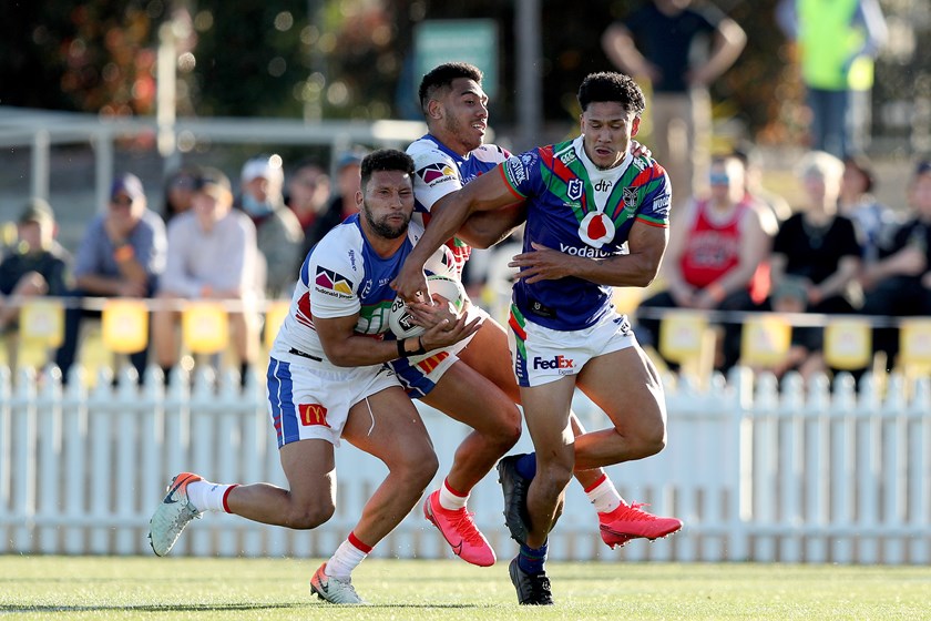Newcastle's Gehamat Shibasaki is crunched by the Warriors.