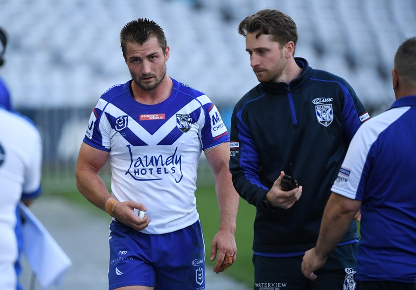 Bulldogs five-eighth Kieran Foran leaves the field with a pectoral injury.