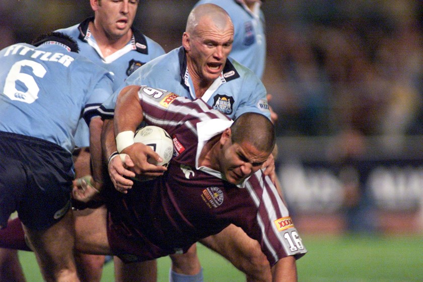 Carl Webb is tackled by Adam Muir and Brad Fittler during the 2001 State of Origin series.
