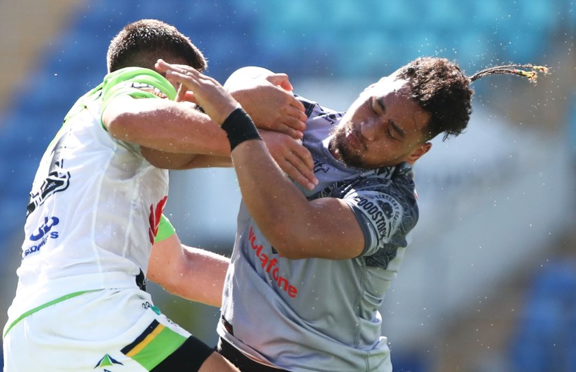 Warriors rookie Eliesa Katoa is crunched in round two against Canberra.