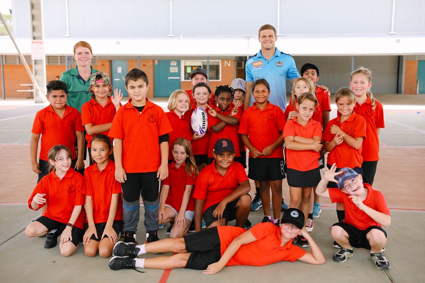 Titans player Dale Copley meets students as part of the Road to Regions in Lightning Ridge.
