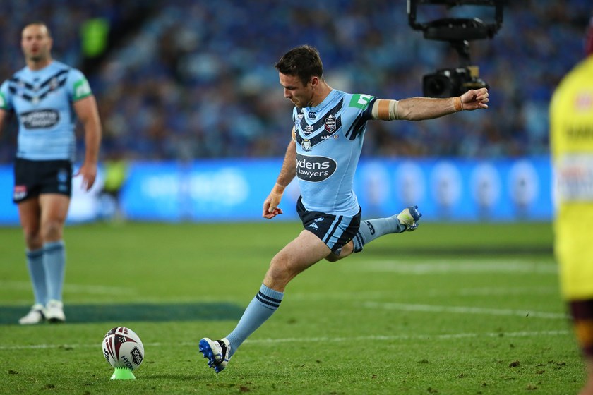 James Maloney takes a kick at goal for the Blues.