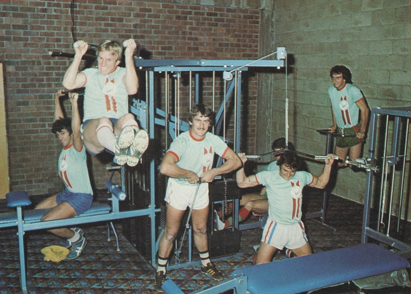 Rabbitohs five-eighth Robert 'Rocky' Laurie with his team-mates in the gym.