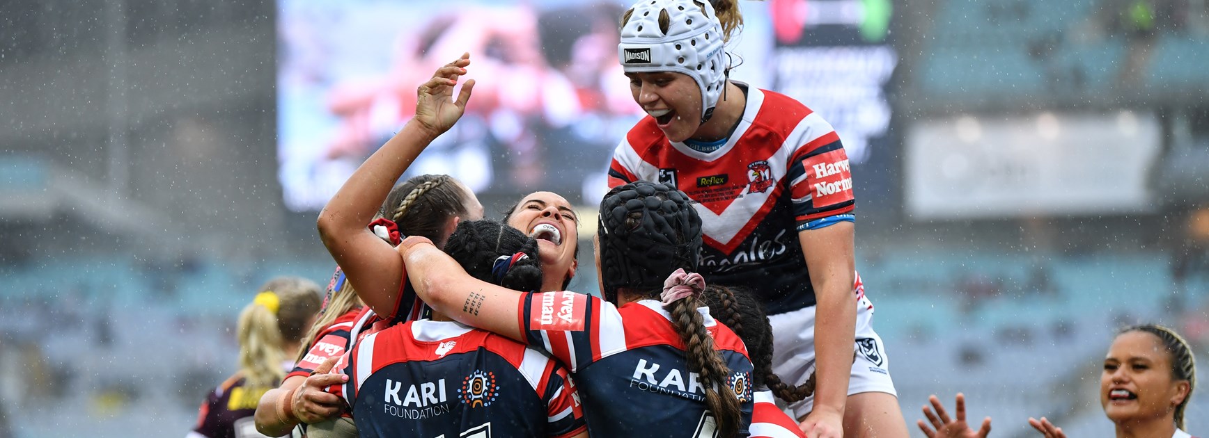 Roosters' players celebrate a try.