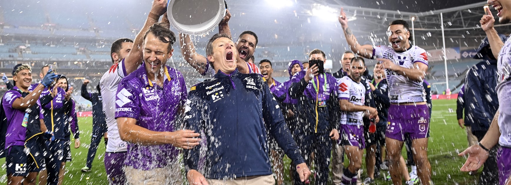 Craig Bellamy is drenched after Melbourne's 2020 grand final win.