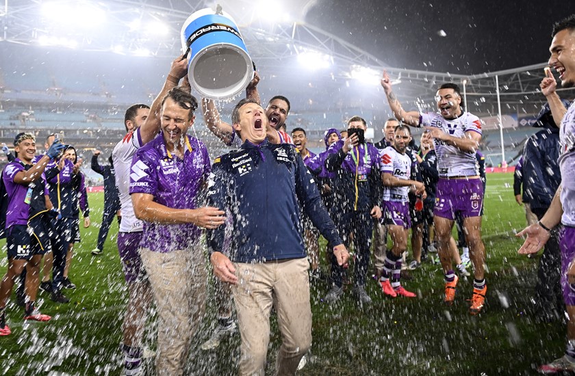 Craig Bellamy is drenched after Melbourne's 2020 grand final win.