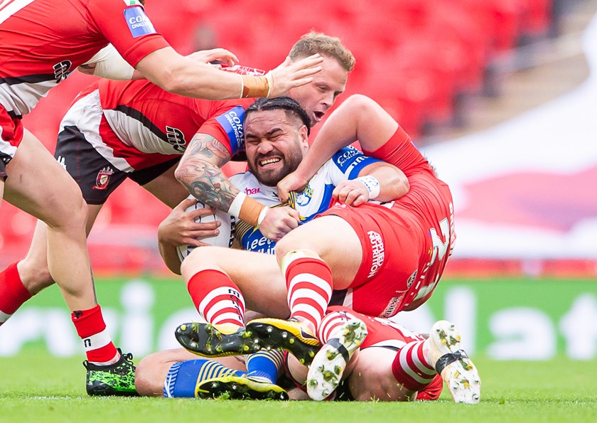 Leeds centre Konrad Hurrell is tackled by Salford's James Greenwood and Kevin Brown.