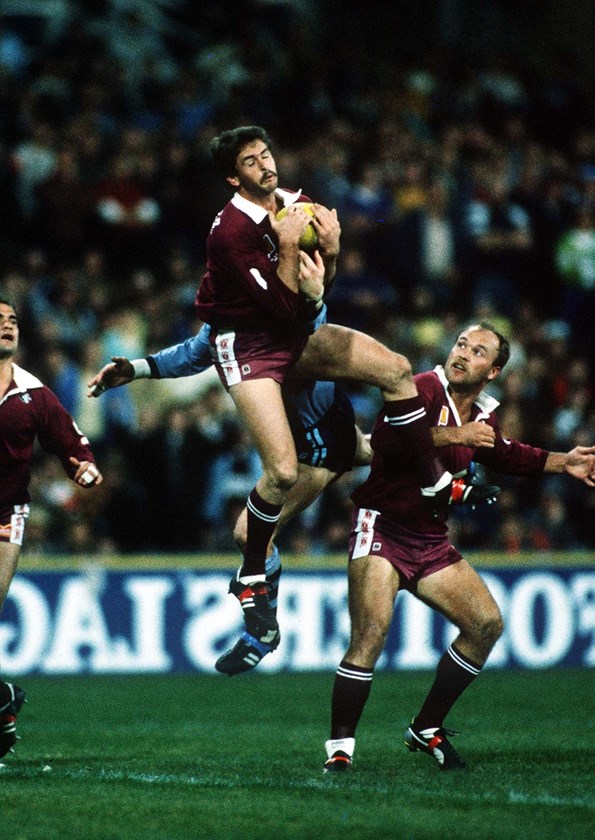 Gary Belcher leaps high in an Origin match.