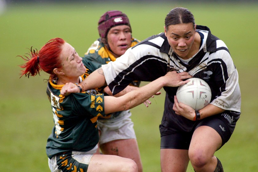 A young Honey Hireme palms off a Cook Islands opponent in 2004.