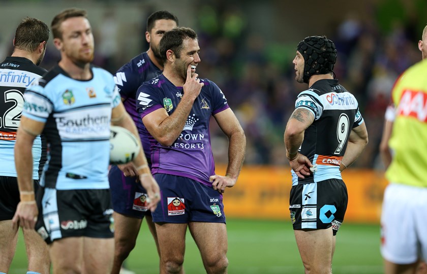 Cameron Smith and Michael Ennis during a Melbourne v Sharks clash in round 26 of 2016.