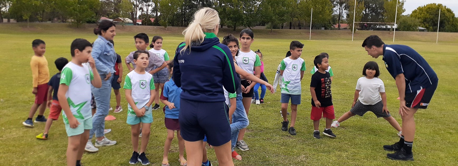 Harmony heroes: Refugees introduced to footy with League Stars, Red Cross