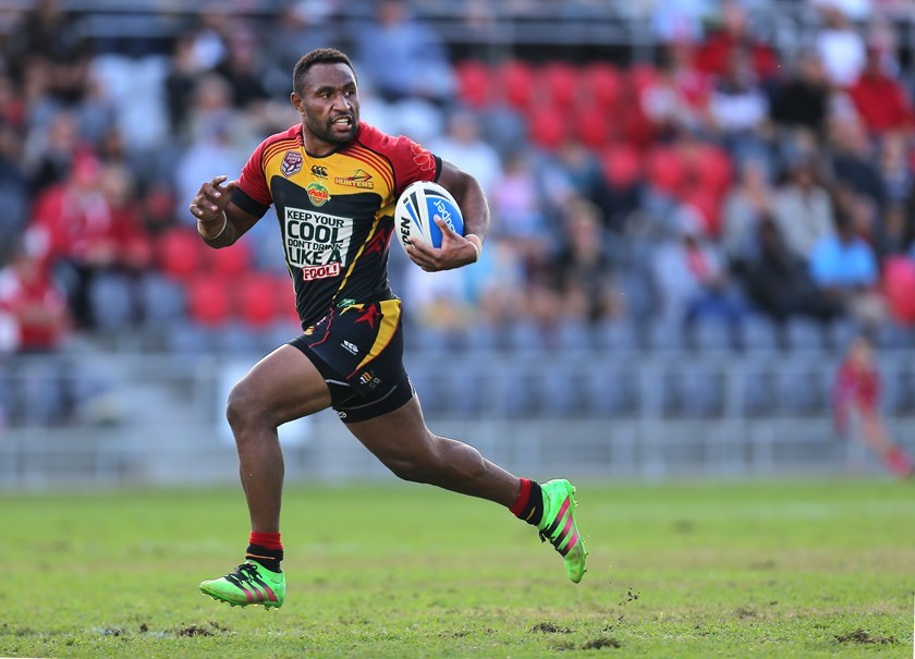 Justin Olam on the run for the PNG Hunters in 2016.