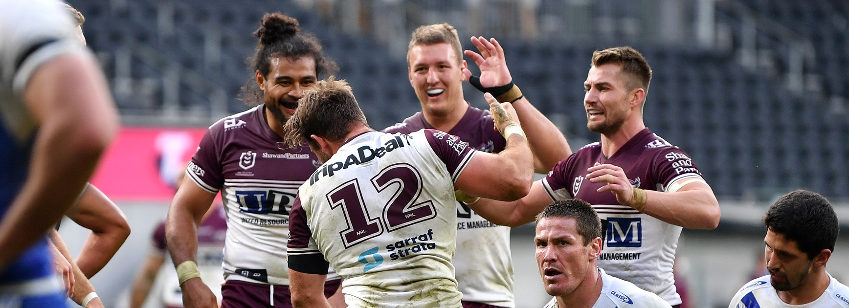 Kieran Foran and happy Manly players.