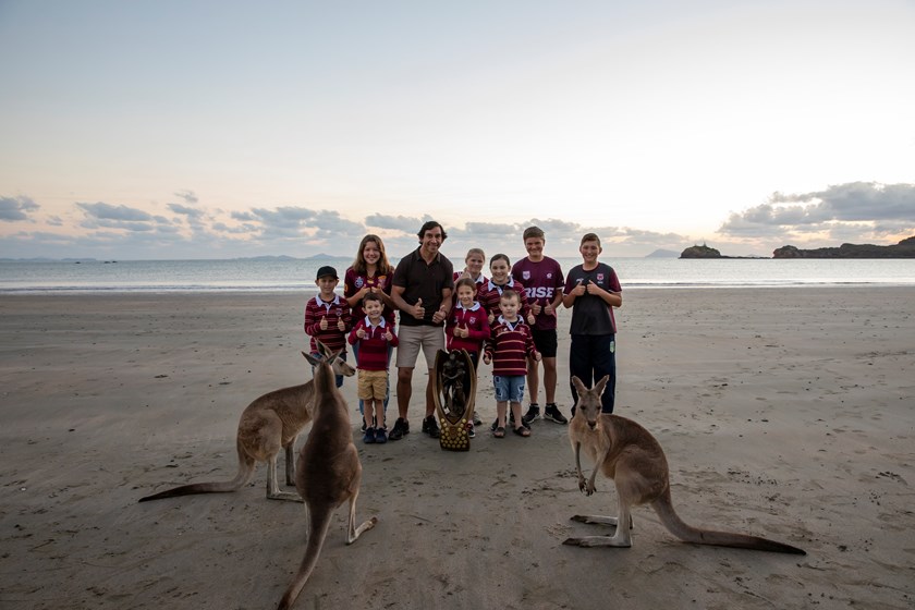 Former Kangaroos representative Johnathan Thurston with some locals of a couple of varieties at Cape Hillsborough