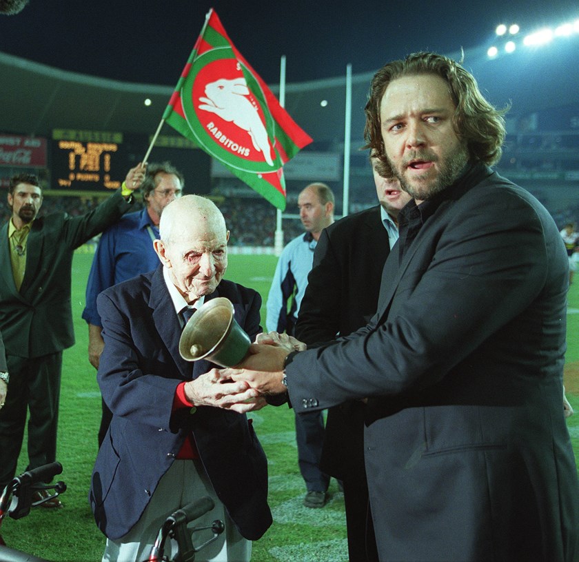Russell Crowe and Albert Clift ring the bell to signal the Rabbitohs' return to the premiership in 2002.