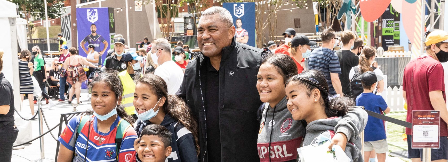 Rugby league legend Petero Civoniceva poses with fans.